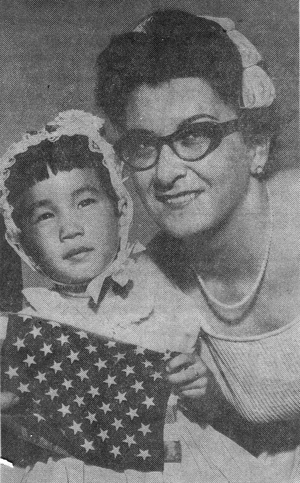 Ramona and mom holding flag